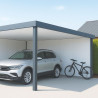 Voiture et vélo protégés sous un carport blanc